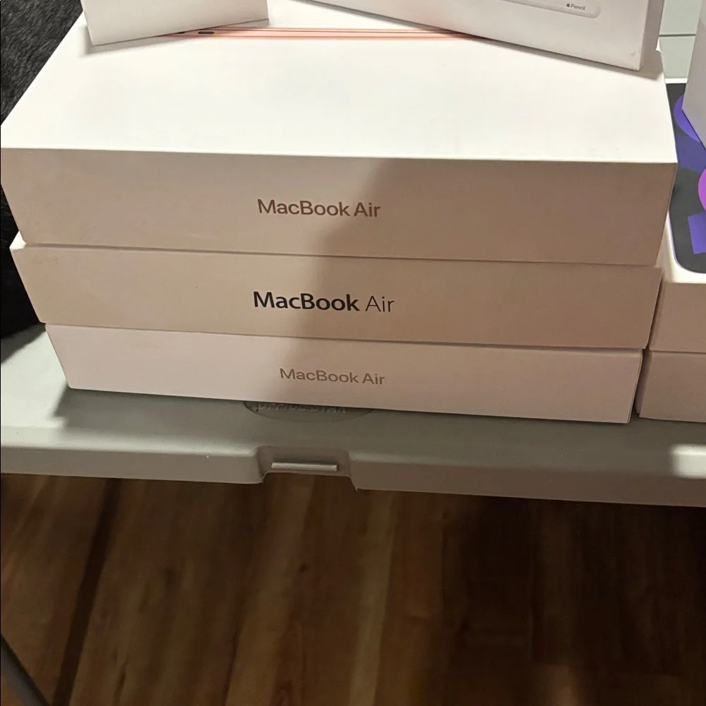 2 Apple iPhone, AirPods, iPad, iPad Air, 1 Pencil, 3MacBook Air 9 Empty Boxes.